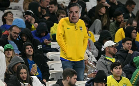 A fan wears a Carlo Ancelotti mask during at Brazil’s game in São Paulo.