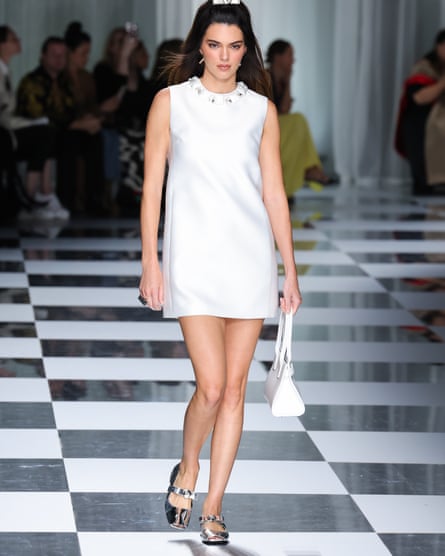 Kendall Jenner wearing a white minidress on the catwalk.