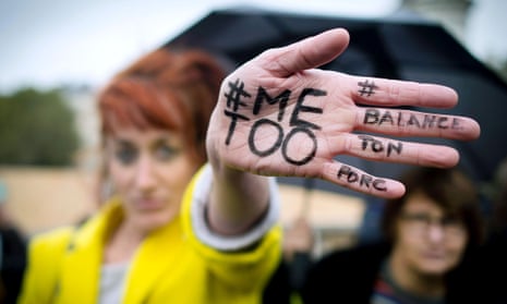 French woman protesting with the hashtag #MeToo written on her hand