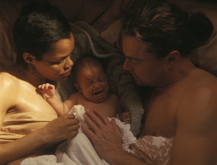 Taylor and Leonardo DiCaprio are seen lying bed with a crying baby between them in One Battle After Another.