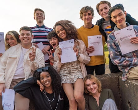 Teenagers holding up certificates