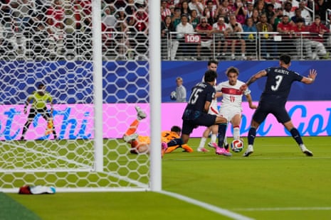 Turkey's Yunus Akgun (19) makes an attempt to score.