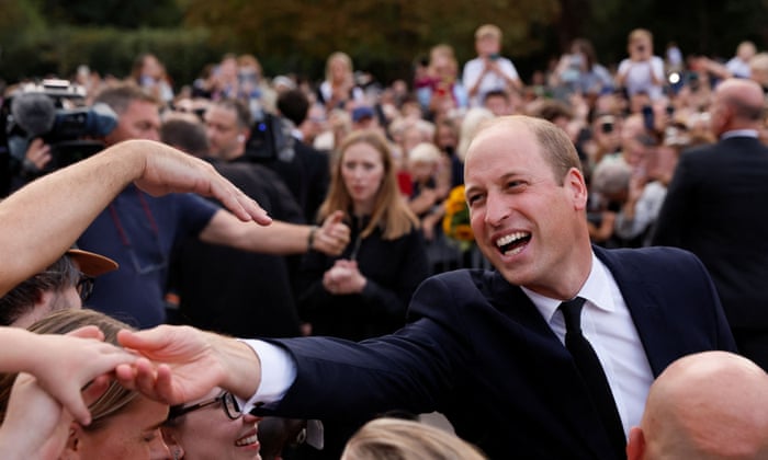 Prince of Wales greets people outside Windsor Castle, following the passing of Queen Elizabeth.