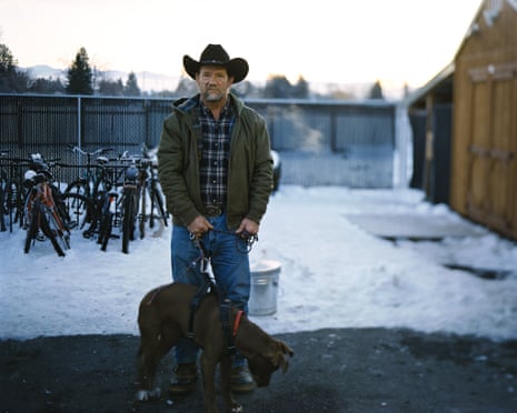 man in cowboy hat with dog