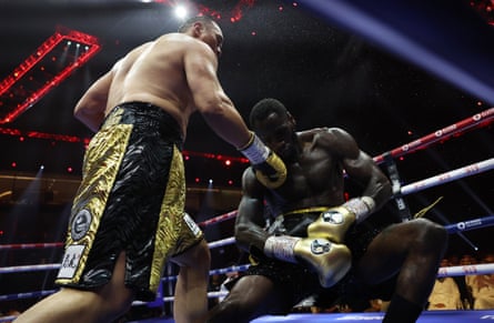 Zhilei Zhang drops Deontay Wilder during the fifth round of their heavyweight non-title fight on Sunday morning at Riyadh’s Kingdom Arena.