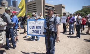 A supporter for gun rights attends a pro open carry rally outside City Hall, across from the NRA convention at Kay Bailey Hutchison Convention Center in Dallas on May 5, 2018.