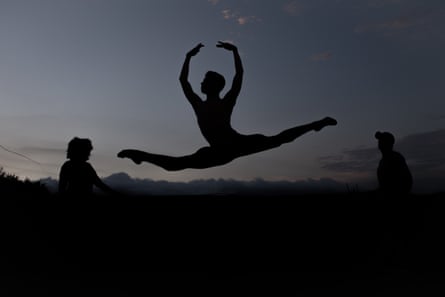 A silhouette of Josue Gomez jumping
