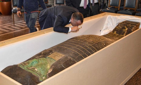 Mostafa Waziri, the head of Egypt's Supreme Council of Antiquities, inspects the returned sarcophagus at the foreign ministry in Cairo.