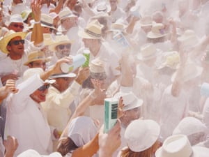 Crowds of people enjoying throwing talcum powder during the Los Indianos Party of the carnival on March 3, 2014 in Santa Cruz de La Palma, Canary Islands. Spain.