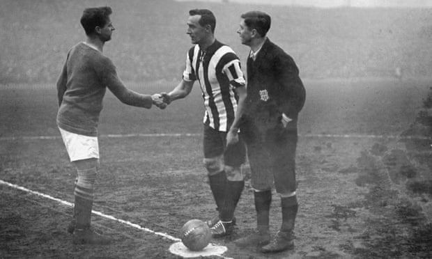 The captains of Chelsea (left) and Sheffield United shake hands before the FA Cup final at Old Trafford in April 1915, which Sheffield United won 3-0.