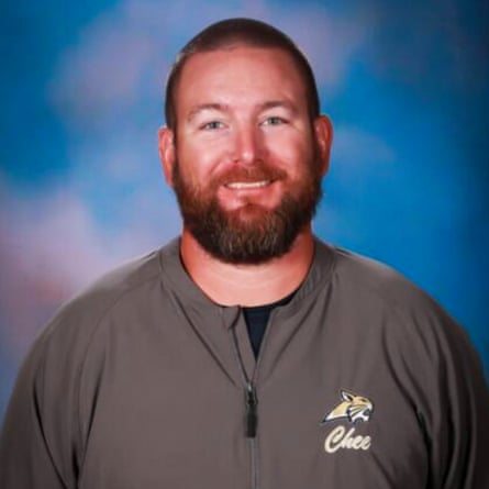 A younger middle-aged man smiles.