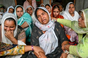 A group of women grieving