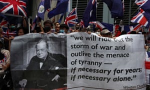 Anti-government protesters hold up banners and union flags outside the British consulate in Hong Kong.