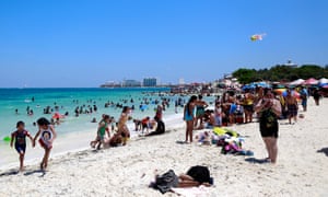 Visitors enjoy the beach in Cancun, Mexico, in April 2015.