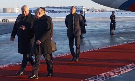 Vladimir Putin is met by Alexander Lukashenko after arriving in Minsk on Monday.