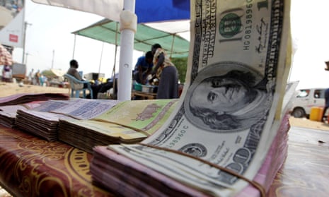 Banknotes are displayed on a roadside currency exchange stall along a street in Juba, south Sudan