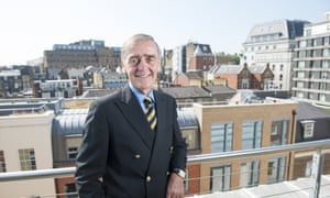 Gerald Grosvenor, 6th Duke of Westminster standing on a balcony with buildings in background.