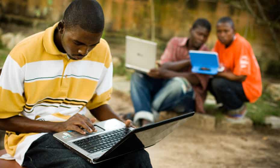 Students use laptops to browse the internet over a wireless network in Ghana.