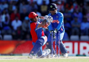 Afghanistan’s Asghar Afghan is bowled out by India’s Yuzvendra Chahal.