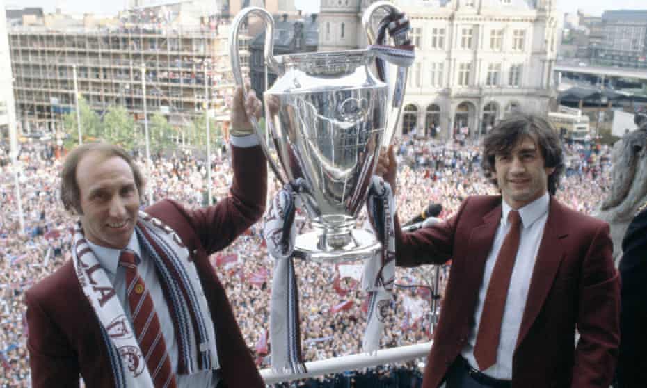Aston Villa manager Tony Barton, left, and captain Dennis Mortimer celebrate with the European Cup in Birmingham after their victory in the 1982 Final.