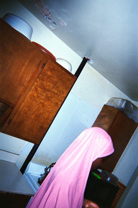 A young girl in a pink hijab.