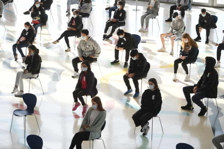 Students wait to receive the Pfizer vaccine for Covid-19 at Qudos Arena in August.