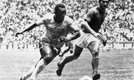 Pelé dribbles past the Italy defender Tarcisio Burgnich during the World Cup final in Mexico in 1970.