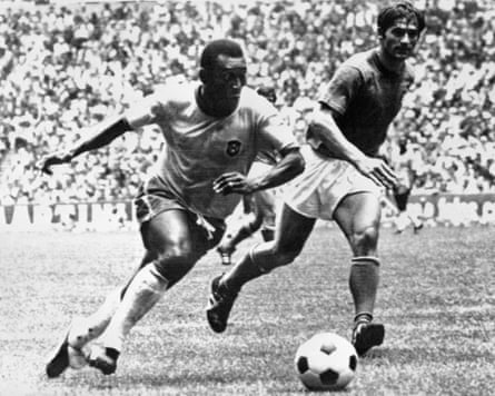Brazil’s Pelé dribbles past an Italy defender