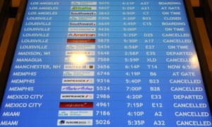 Flight departure board showing lots of cancellations.