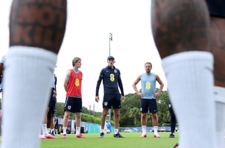 Thomas Tuchel giving instructions, photographed betwixt nan legs of 1 of nan players