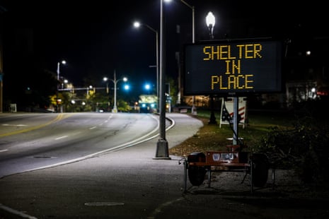 A road sign reads 'Shelter in Place' in Lewiston.