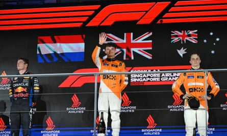 McLaren’s Lando Norris waves to the crowd after winning in Singapore.
