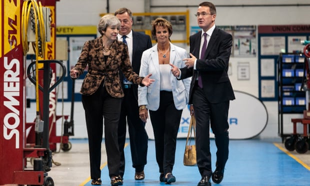 Theresa May at a coach building company in Guildford, August 2017