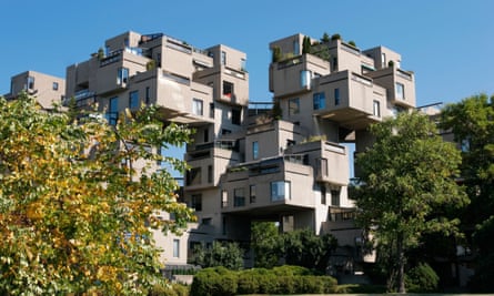 A cubist apartment block with rooms jutting out over landscaped gardens.