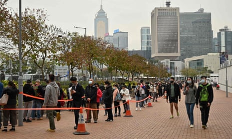 People queue at a mobile specimen collection station for Covid-19 testing in Hong Kong’s central district.