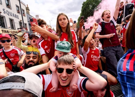 Fans celebrate Arsenal’s men and women’s success on the streets of north London in May