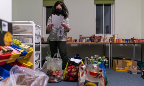 A volunteer packs food parcels in Edinburgh: ‘A recent survey by the Trussell Trust found that almost one in 10 parents are likely to use a food bank in the coming months.’