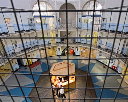 An aerial view showing a floor with a large star-like pattern made of tiles and a booth in the middle.