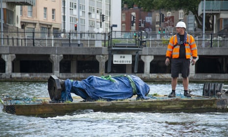 The statue of Edward Colston is recovered from the harbour in Bristol after it was toppled by anti-racism protesters on Sunday