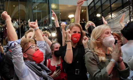 Supporters react after German parliament election at the Social Democratic Party, SPD, headquarters in Berlin, Sunday, Sept. 26, 2021. (AP Photo/Lisa Leutner)