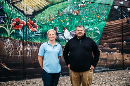 Ben and Helen Taylor-Davies in front of mural - photo taken at closer range than previous image