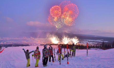 Skiers watch the fireworks during the opening ceremony in Samjiyon.