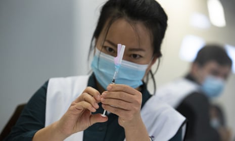 A health professional prepares a Pfizer/BioNTech vaccine to be administered.