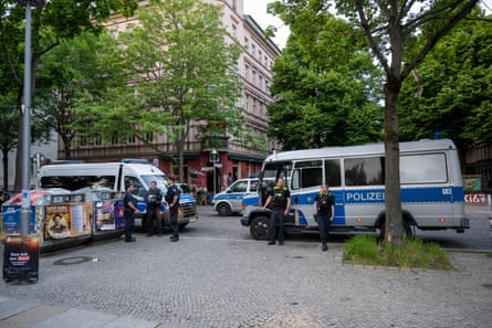 Police officers guard the entrance to Görlitzer Park