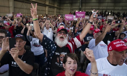 Supporters of Donald Trump cheer as he arrives to speak during a campaign rally at Arnold Palmer regional airport in Latrobe.