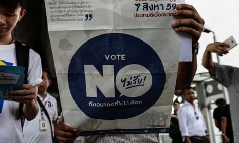 A Thai activist displays banned material during a protest against the military crackdown on discussion and debate around the new draft constitution.