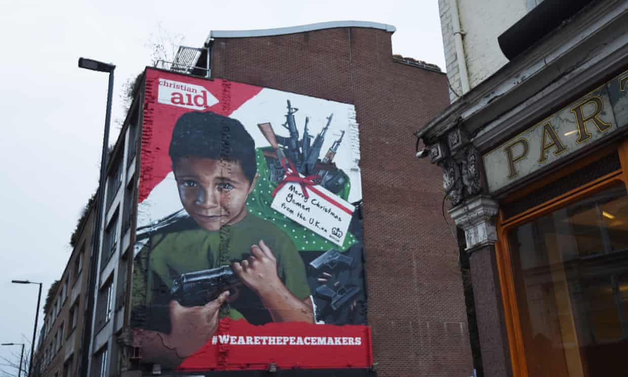 A mural in London depicts a Yemeni boy with a gun, part of a Christian Aid campaign against UK arms exports to Saudi Arabia.