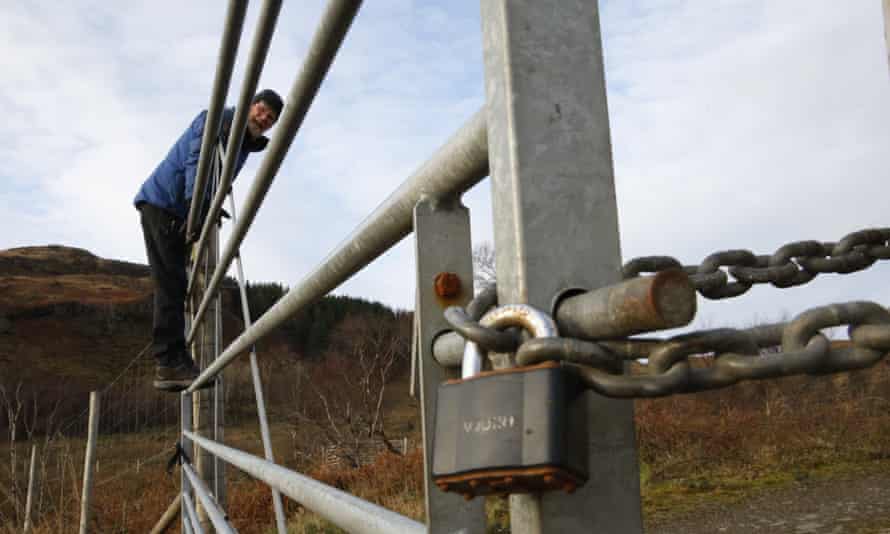 David Kime climbing a locked gate