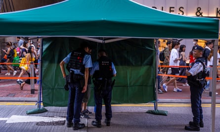 Police questioning members of the public near Victoria Park, Hong Kong