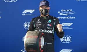 Valtteri Bottas poses with the trophy for taking pole for the Eifel F1 GP at the Nürburgring